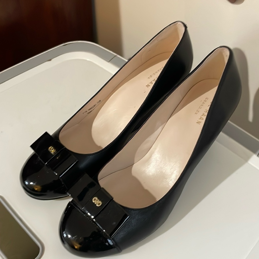 These are Cole Haan black dress wedges. 7-7.5B